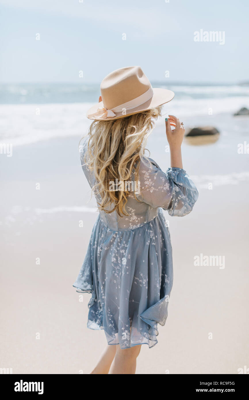 Woman dress rear view windy hi-res stock photography and images - Alamy