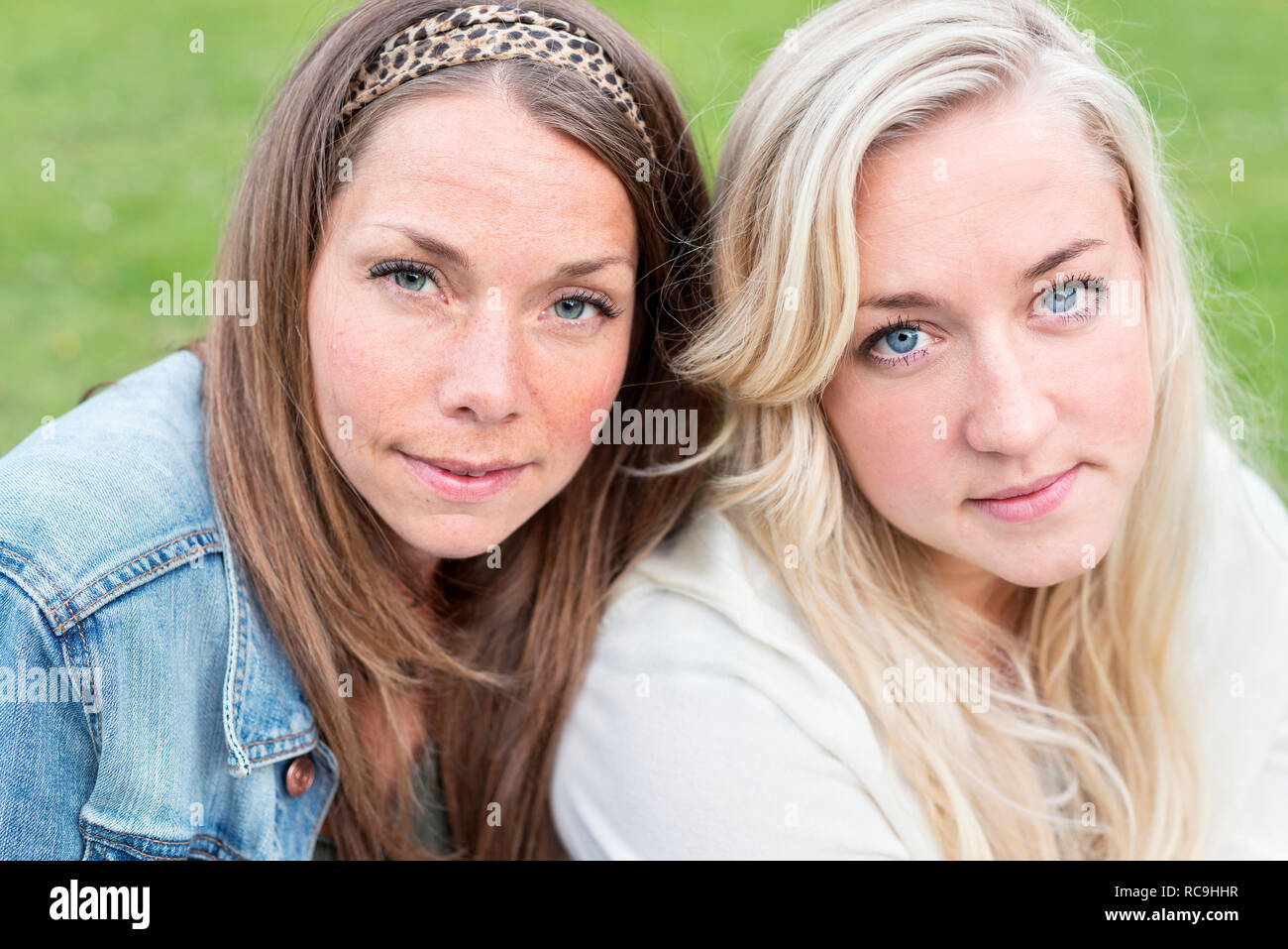 Portrait two young positive women hi-res stock photography and images ...