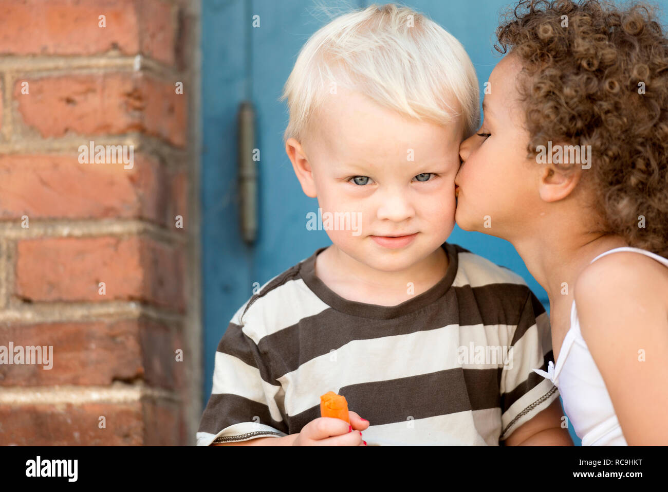 Boy kiss girl cheek hi-res stock photography and images - Alamy