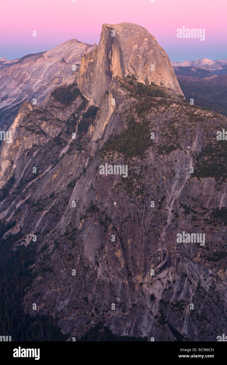 A view of half dome at dusk from a higher vantage point across the valley. California, USA Stock Photo