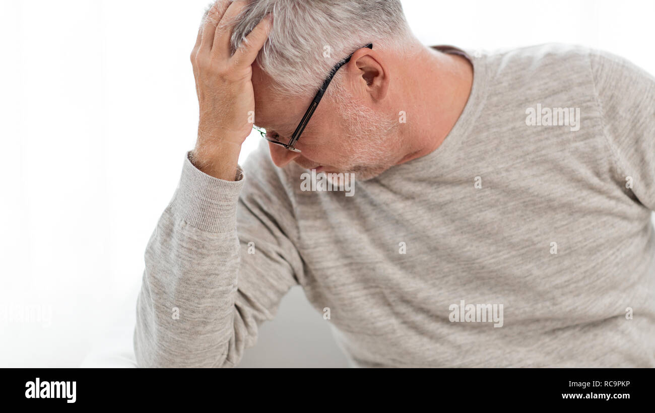 senior man suffering from headache at home Stock Photo - Alamy