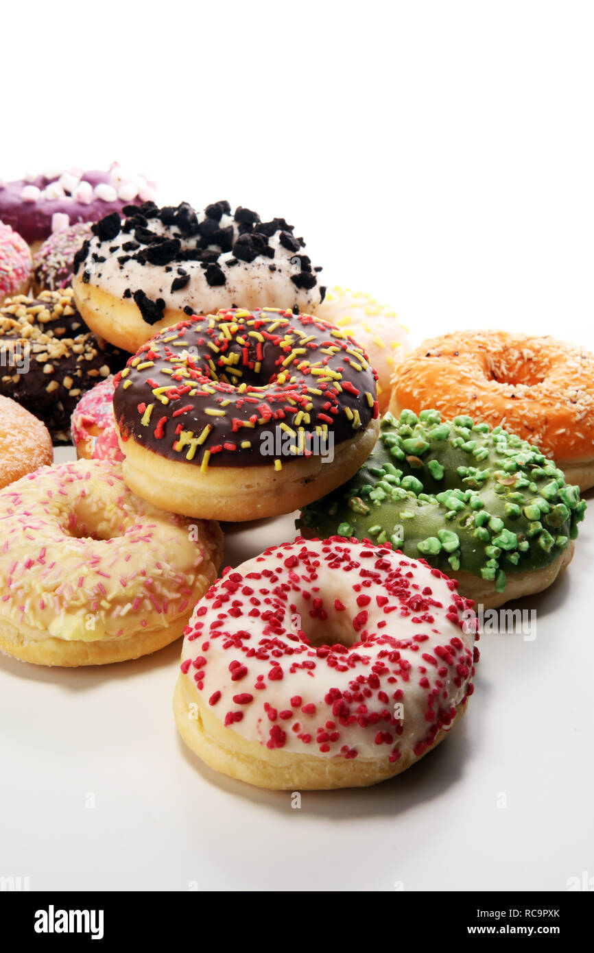 assorted donuts with chocolate frosted, pink glazed and sprinkles ...