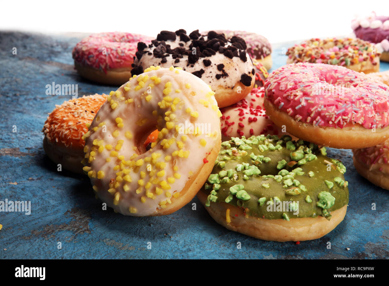assorted donuts with chocolate frosted, pink glazed and sprinkles ...