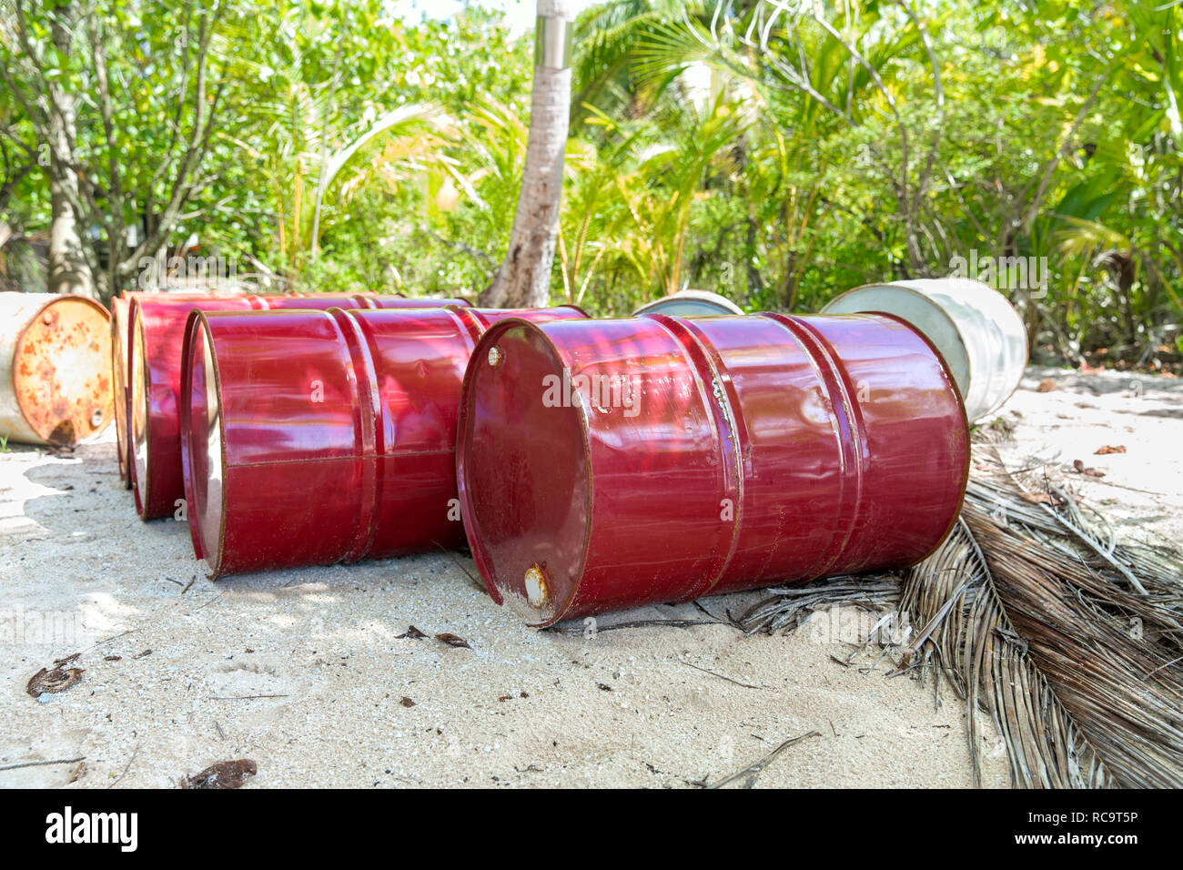 oil drum barrels on beach in french polynesia Stock Photo