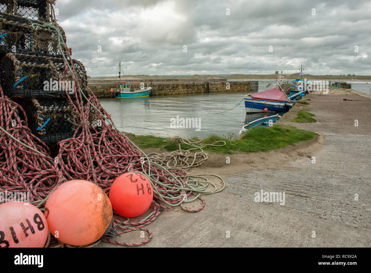 The village of Beadnell can be found on the Northumberland coast some two miles south east of Seahouses. Beadnell Harbour is said to have the only wes Stock Photo