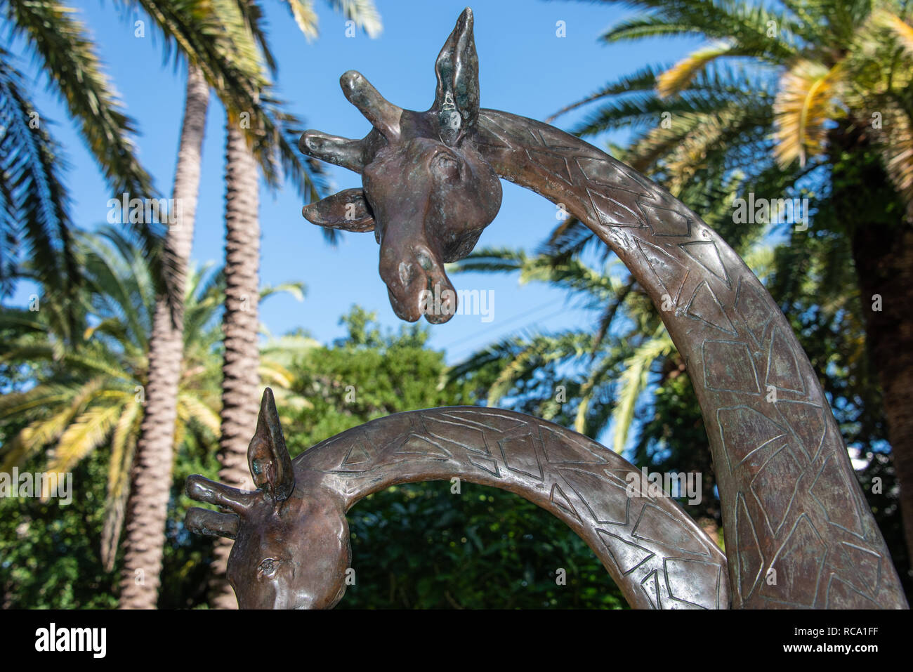 'Giraffes' bronze sculpture by American artist Henry Mitchell at the Philip Hulitar Sculpture Garden, Society of the Four Arts, Palm Beach, Florida. Stock Photo