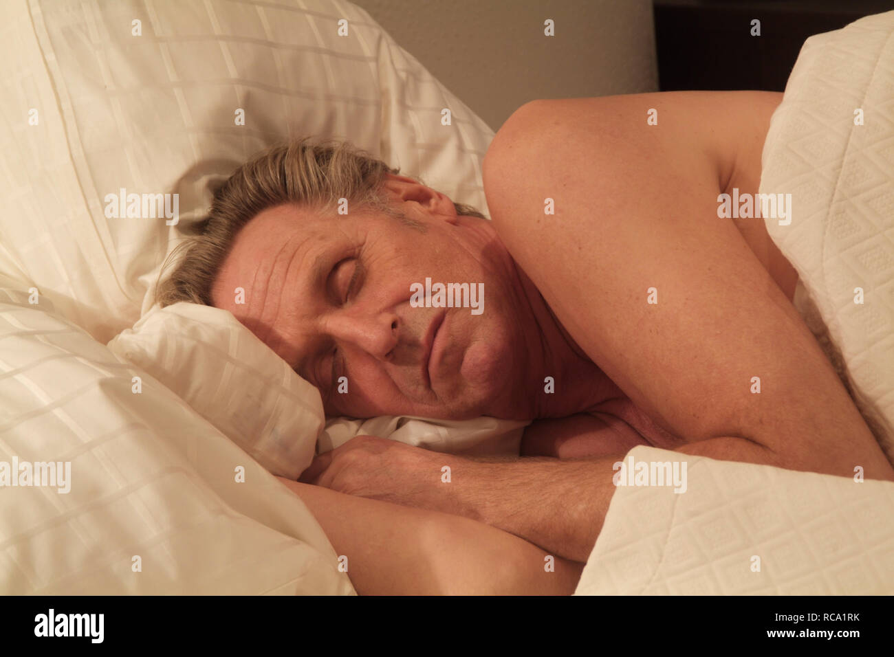 Mann mittleren Alters schläft | middleaged man is sleeping Stock Photo