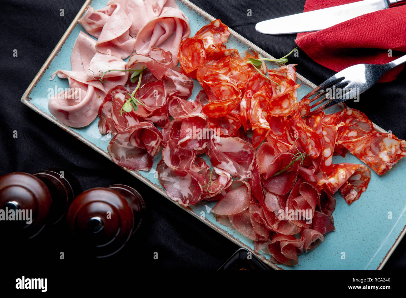 assorted cold meat, prosciutto, slices ham, beef jerky, salami, meat