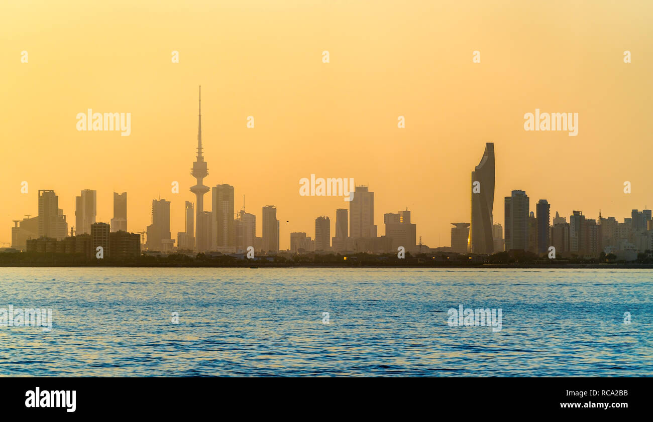 Skyline of Kuwait City at sunset. Stock Photo