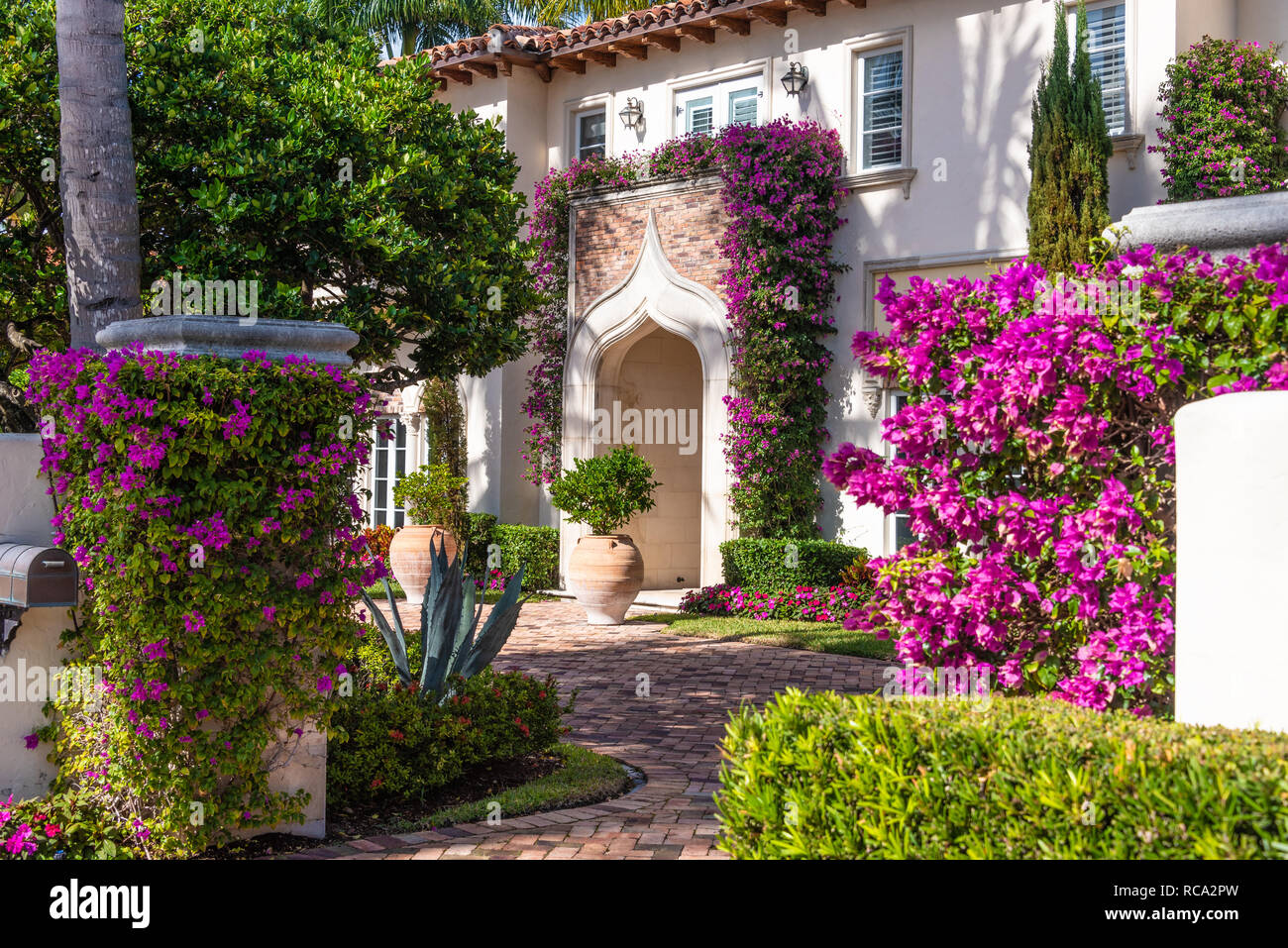 Mediterranean Revival Style home with vibrant bougainvillea in Palm Beach, Florida. (USA) Stock Photo