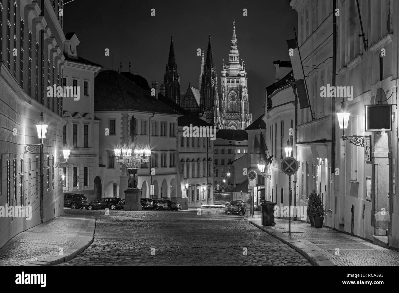 Prague - The St. Vitus cathedral and the Loretánská street at night. Stock Photo