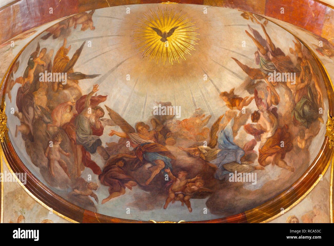 PRAGUE, CZECH REPUBLIC - OCTOBER 12, 2018: The ceiling fresco of Holy Spirit among the angels in St. Francis of Assisi church by Jan Kryštof Liška Stock Photo