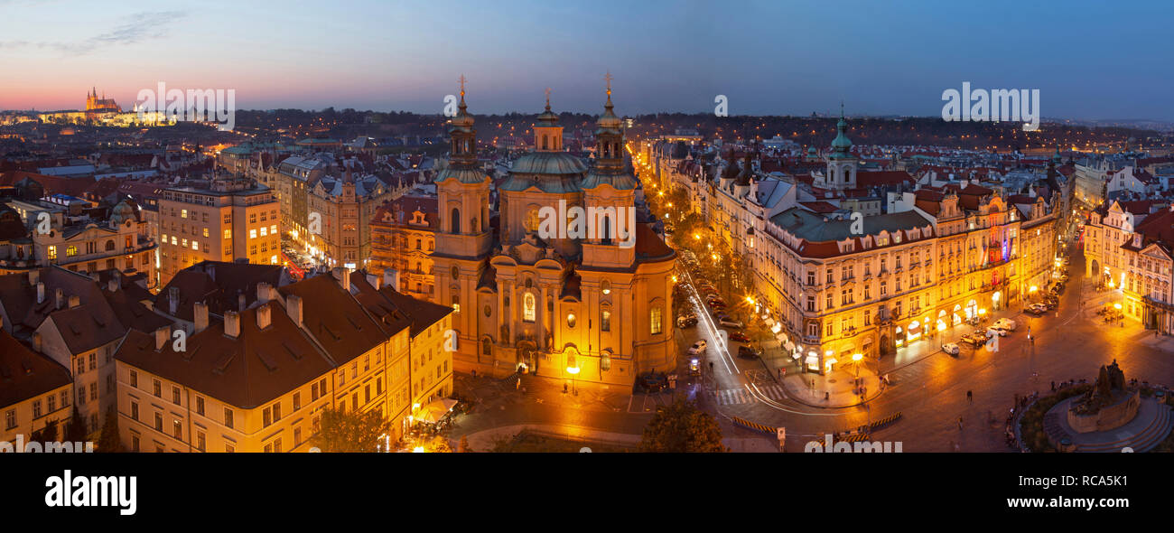Prague - The panorama with the St. Nicholas church,   Staromestske square and the Old Town at dusk. Stock Photo