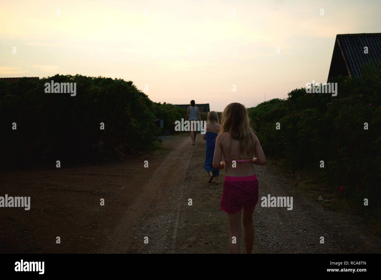 Family rear view girls walking hi-res stock photography and images - Alamy