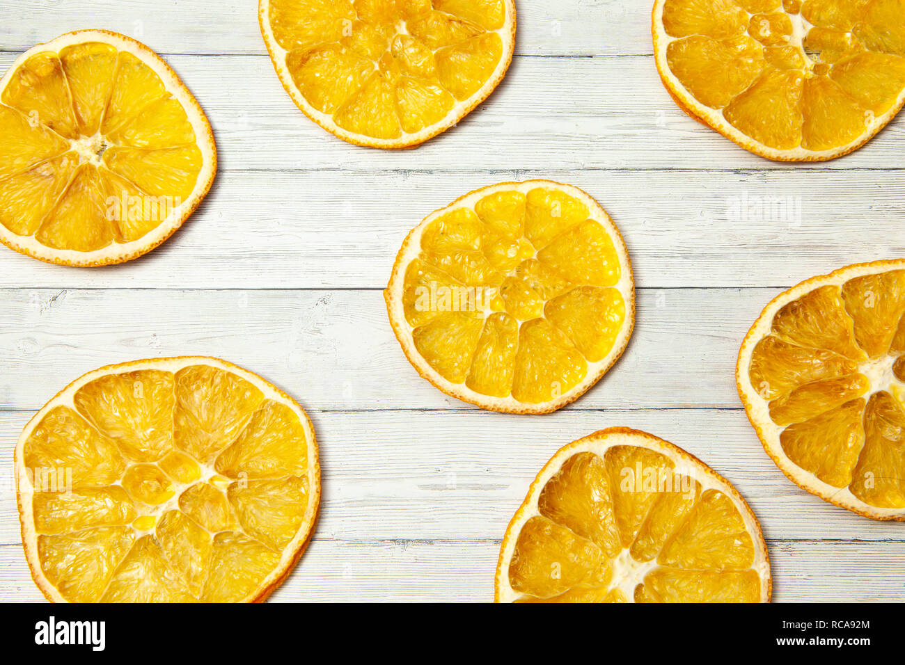 Orange slice on wood background, top view Stock Photo