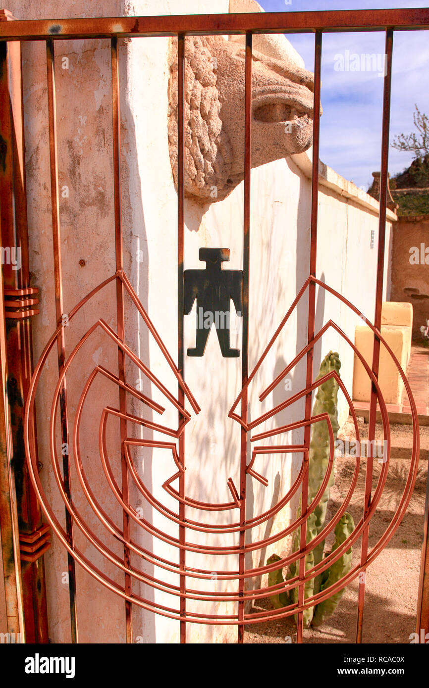 Metal gate with Native American artwork at the San Xavier del Bac