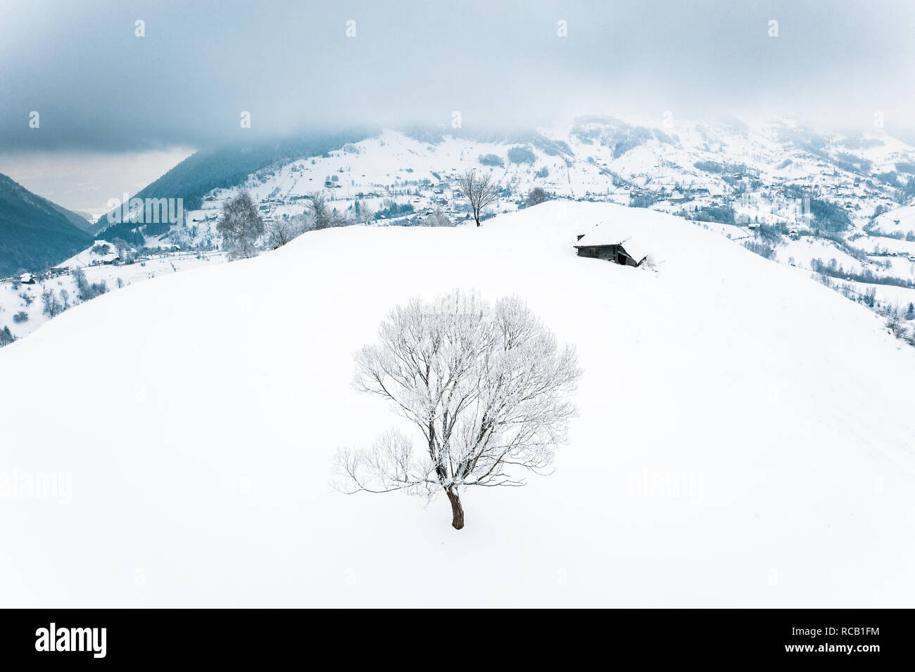 Winter in the traditional villages in the Carpathian Mountains, Romania Stock Photo