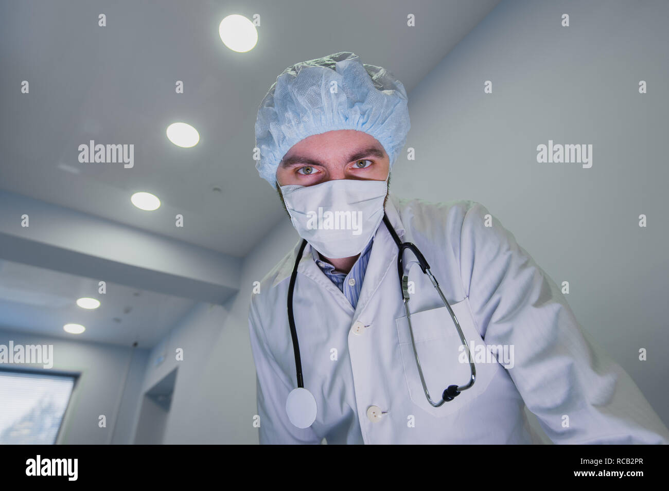 Surgeons looking down at patient getting ready for urgent surgery Stock ...
