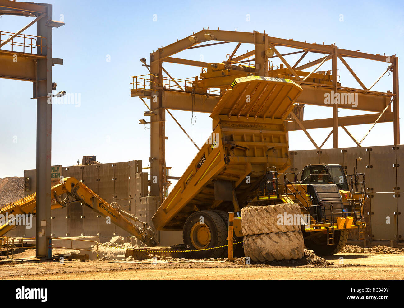 Heavy machinery working at the  Fimiston Open Pit gold mine, known as the  'Super Pit' a massive open cast  mine at Kalgoorlie, Western Australia Stock Photo