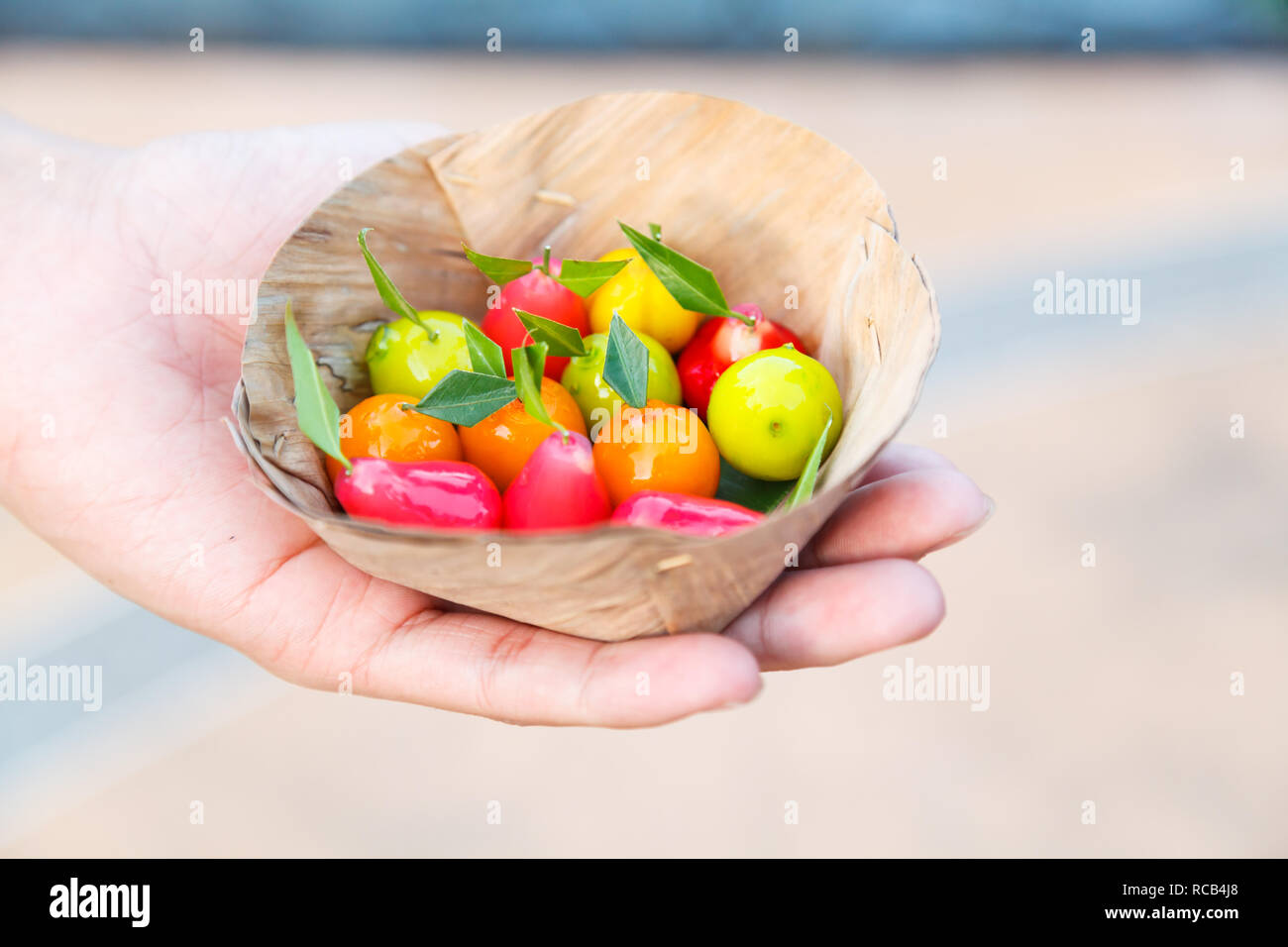 Luk Chup (Look choop, Look Chub), Traditional Colorful Thai dessert derived from marzipan, use green beans (mung beans) as main ingredient. It is mold Stock Photo