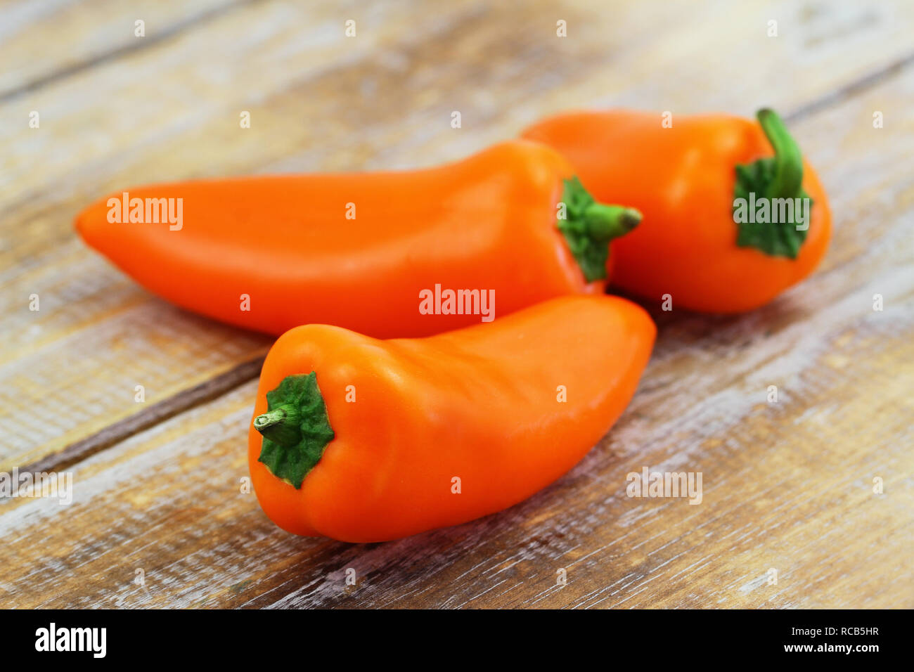 Crunchy snack paprika on wooden surface, closeup Stock Photo