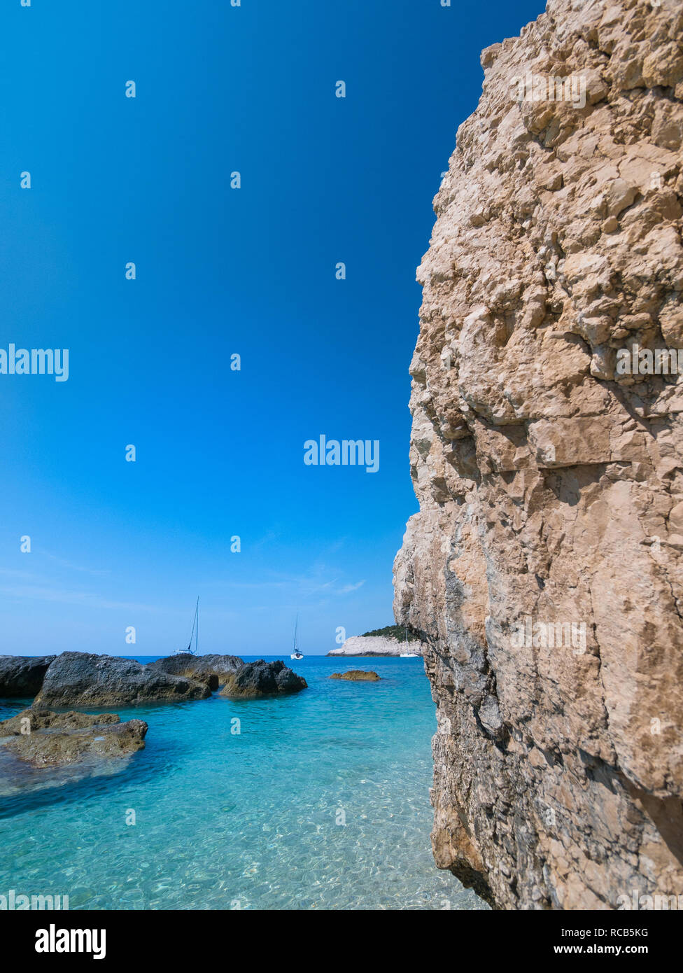 Amazing views of crystal clear milky blue waters of exotic Lefkada beaches and breathtaking cliffs in Greece. Stock Photo