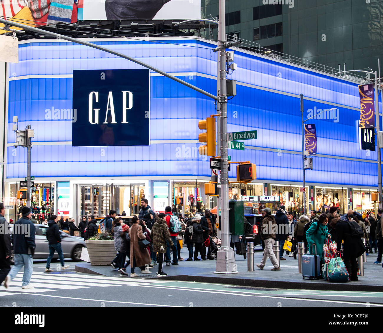 New York City, United States - November 17 2018:   The neon lit frontage of the Gap clothing store on the corner of Boradway and  West 44th Street Stock Photo