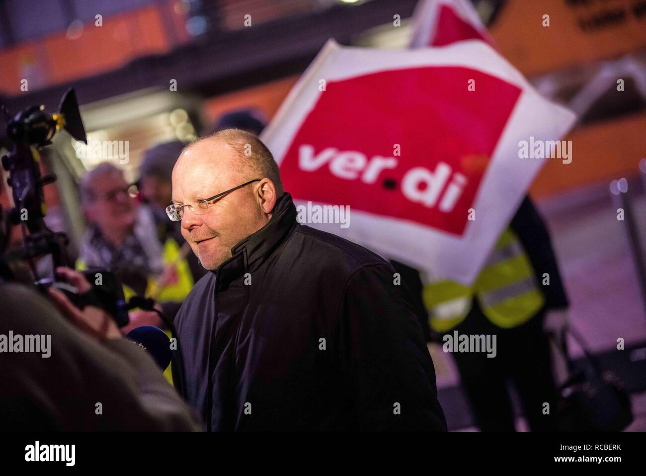 Munich, Bavaria, Germany. 15th Jan, 2019. Kai Winkler of the Verdi union at the Munich International Airport. Citing a breakdown in talks with employers on December 21st, the German Ver.di union organized the latest warning strike in a series at the Munich International Airport with members employed in Airport Security Services (Luftsicherheit) walking out from 3:30am to 24:00. The union is demanding 20 Euros per hour for their 1,000 total members working in Passenger-, Freight, Personnel, and Goods Control of Airport Security, along with recertification to bring other members to the same Stock Photo