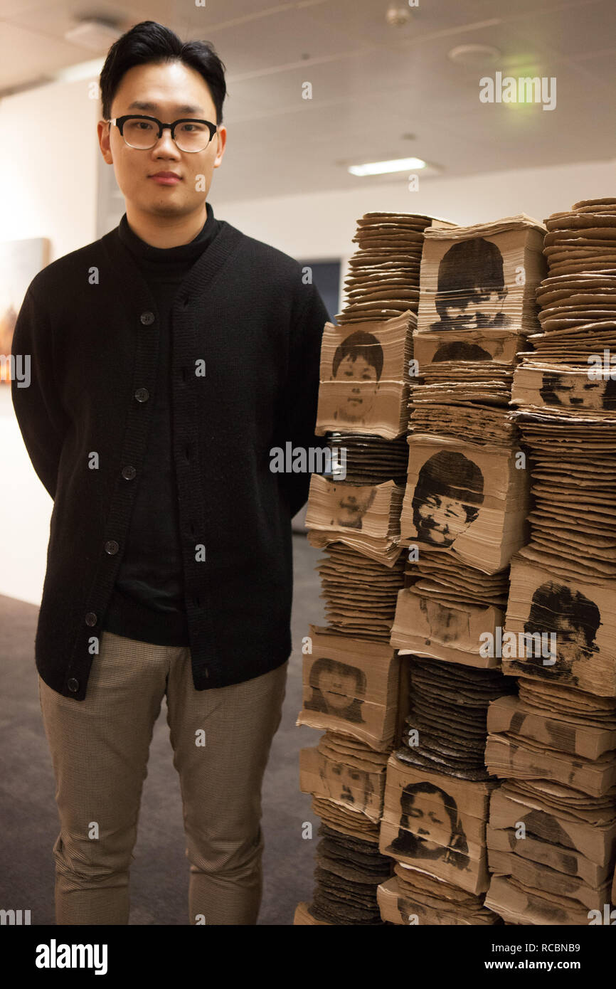London, UK. 15th January, 2019. Korean artist Ilkwon Yoon with his sculpture 'Memory', comprising portraits of children from his primary school class printed on bundles of paper napkins, at the London Art Fair 2019 which takes place at the Business Design Centre, Islington, from 16-20 January. Credit: Anna Watson/Alamy Live News Stock Photo