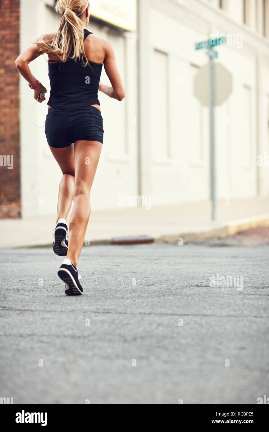 Woman jogging in city Stock Photo
