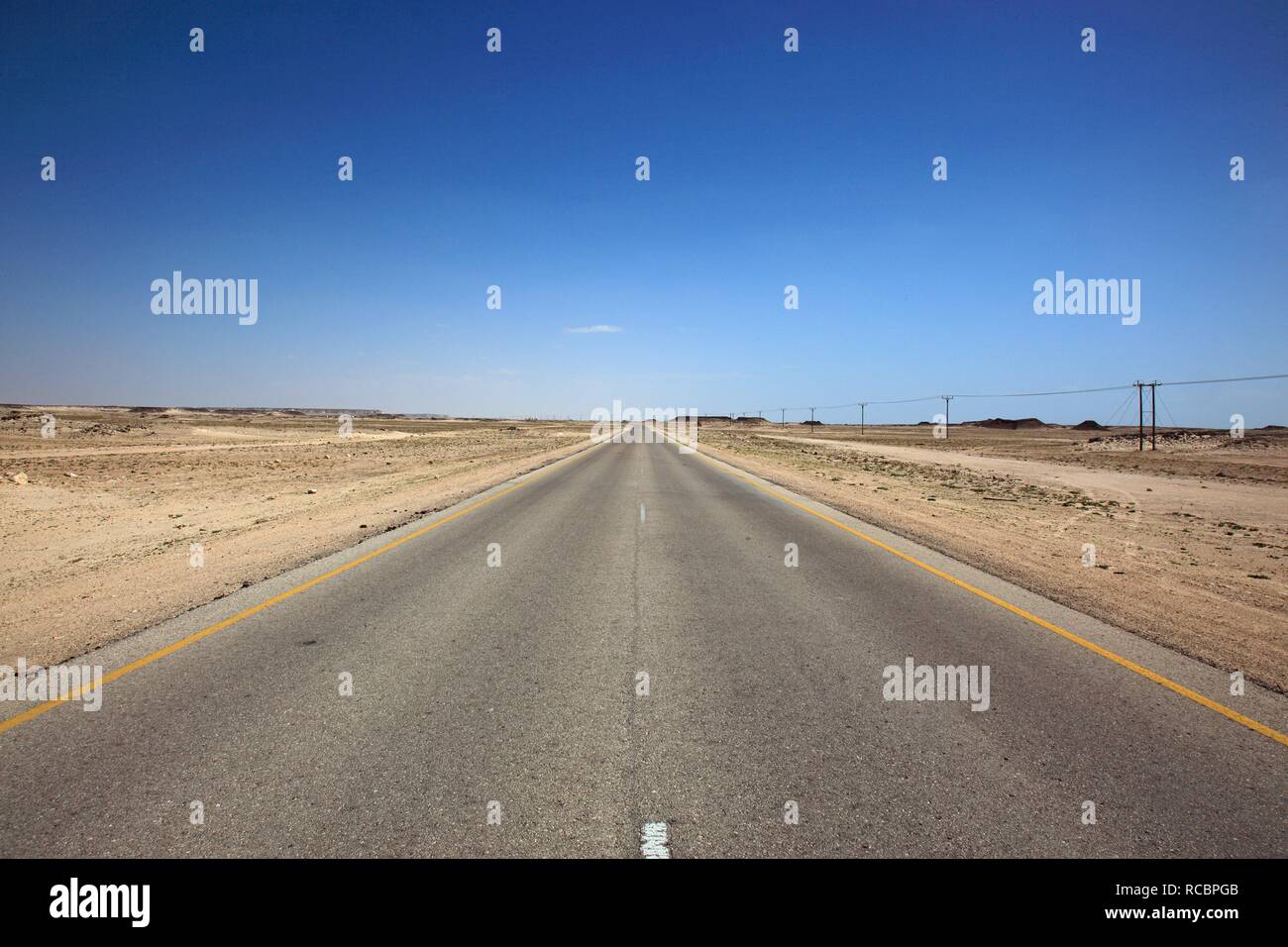 Lonely road through the Empty Quarter, ar-Rub al-Khali, Oman, Arabian Peninsula, Middle East, Asia Stock Photo