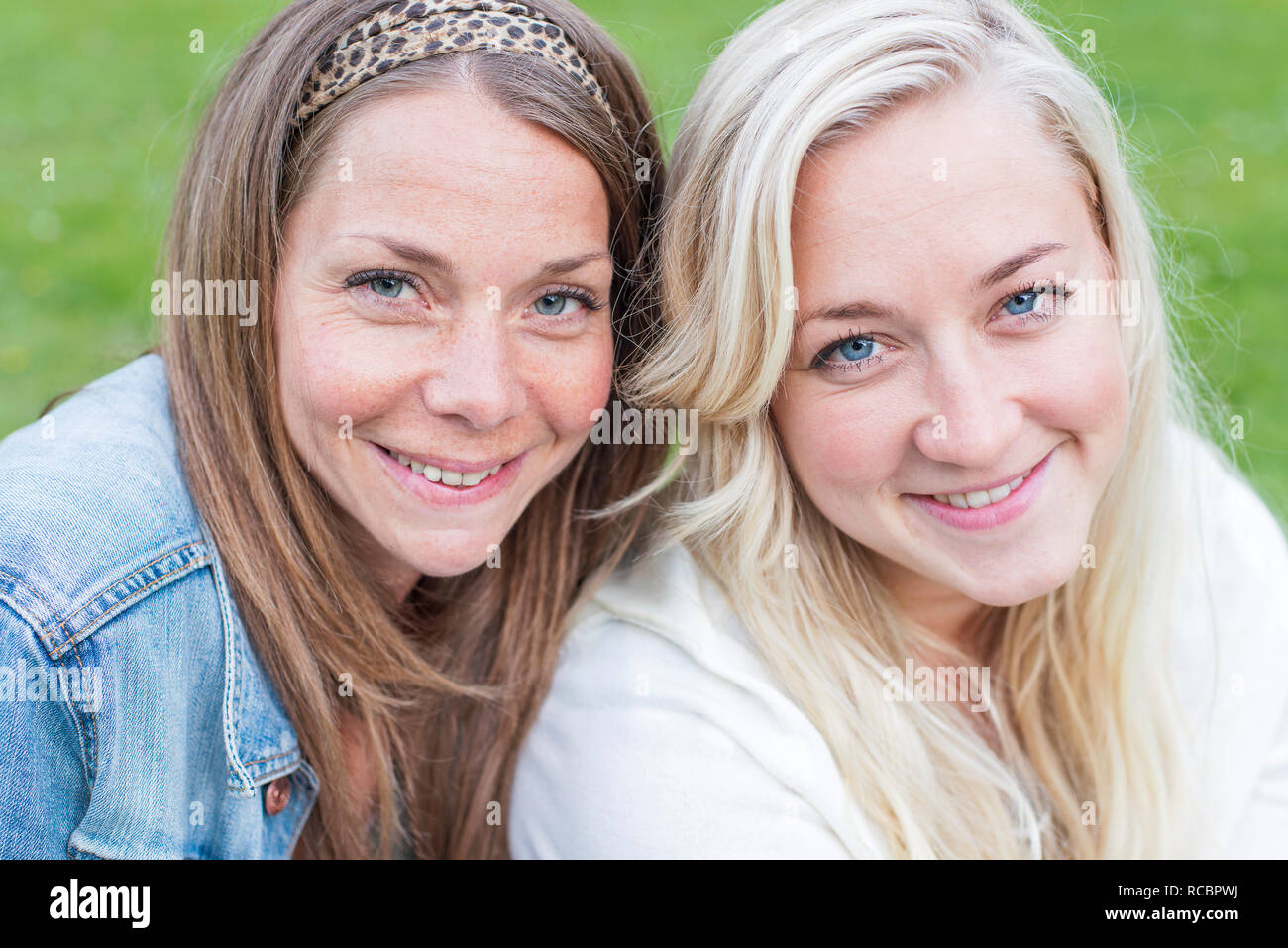 Portrait of smiling young women Stock Photo