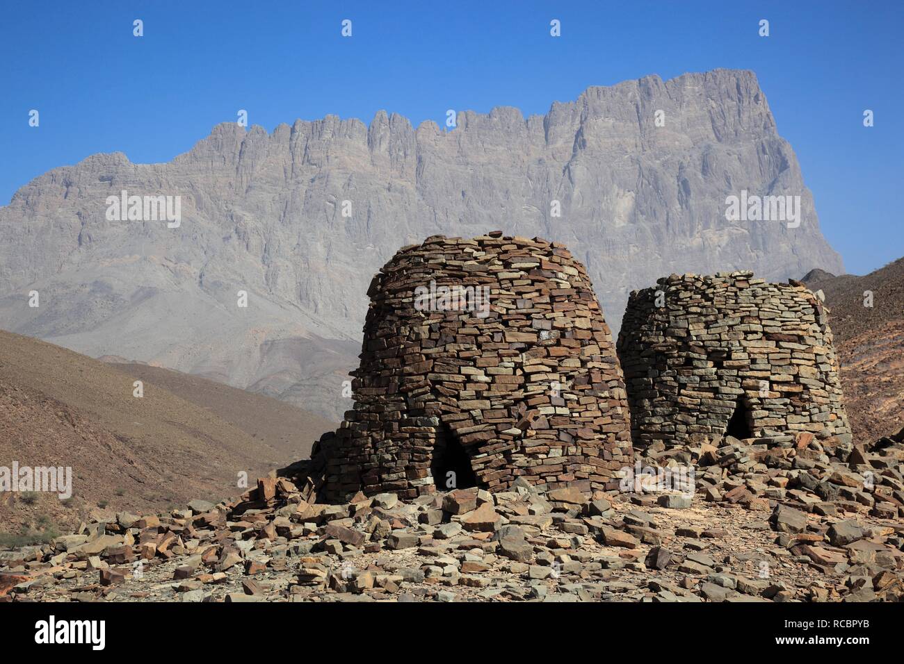 The Beehive Tombs of Al-Ayn on the edge of Jebel Misht mountain ridge, in the area between the towns of Bat and Al-Ayn in the Stock Photo