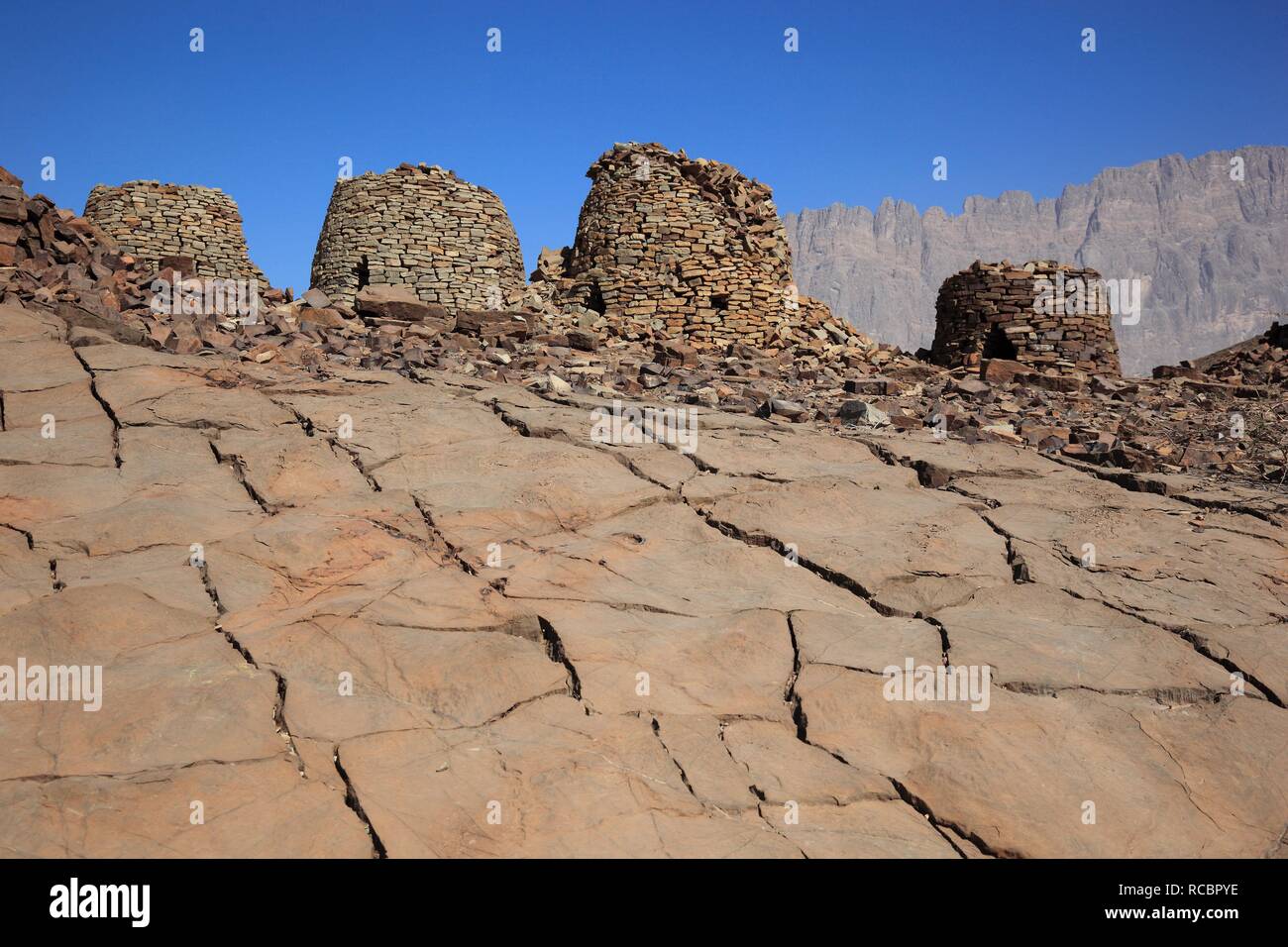 The Beehive Tombs of Al-Ayn on the edge of Jebel Misht mountain ridge, in the area between the towns of Bat and Al-Ayn in the Stock Photo