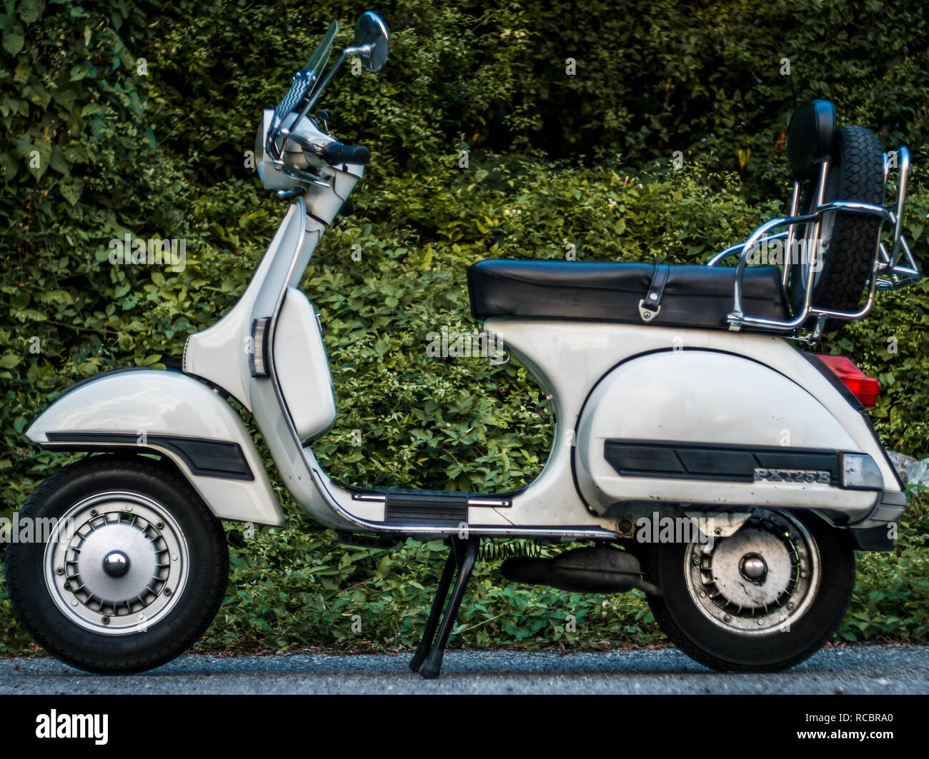 vespa piaggio 50 cc special 125 px white parking sunset in nature Stock  Photo - Alamy