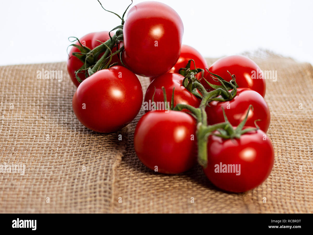 Bright red tomatoes add a burst of color. Stock Photo