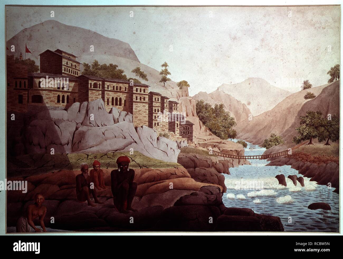 Devaprayaga and a rope bridge across the Bagirathi, Garhwal (U.P.). 'Sliteared' ascetics sitting on the rocks in the foreground and a woman washing her clothes. 11th May 1808. watercolour. Source: WD 345. Author: Hearsey, Hyder Young. Stock Photo