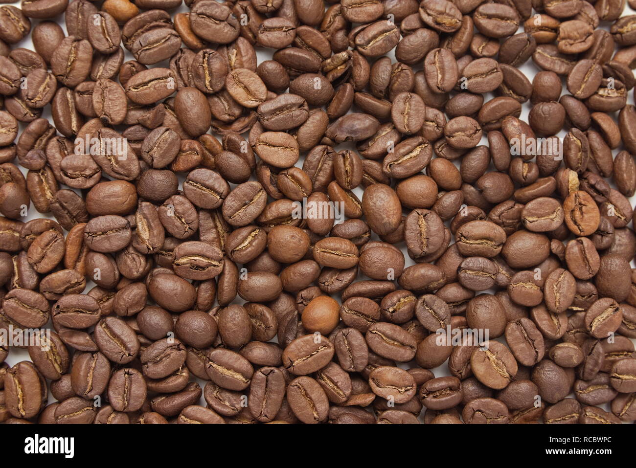 Brown Roasted Coffee Beans Top View Closeup Stock Photo - Alamy
