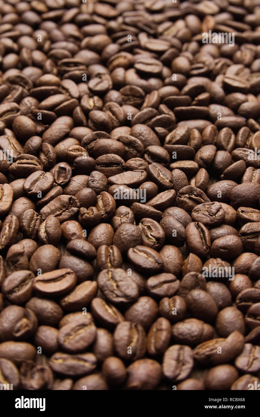 Brown Roasted Coffee Beans Closeup Vertical Background Stock Photo - Alamy