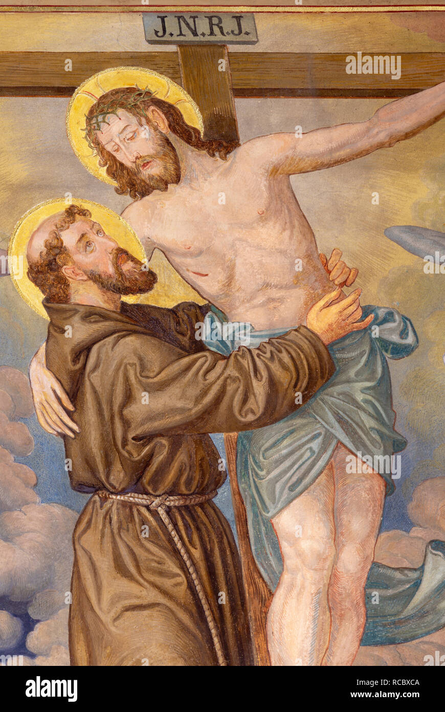 PRAGUE, CZECH REPUBLIC - OCTOBER 12, 2018: The symbolic idilic painting of St. Francis of Assisi and crucificted Jesus Stock Photo