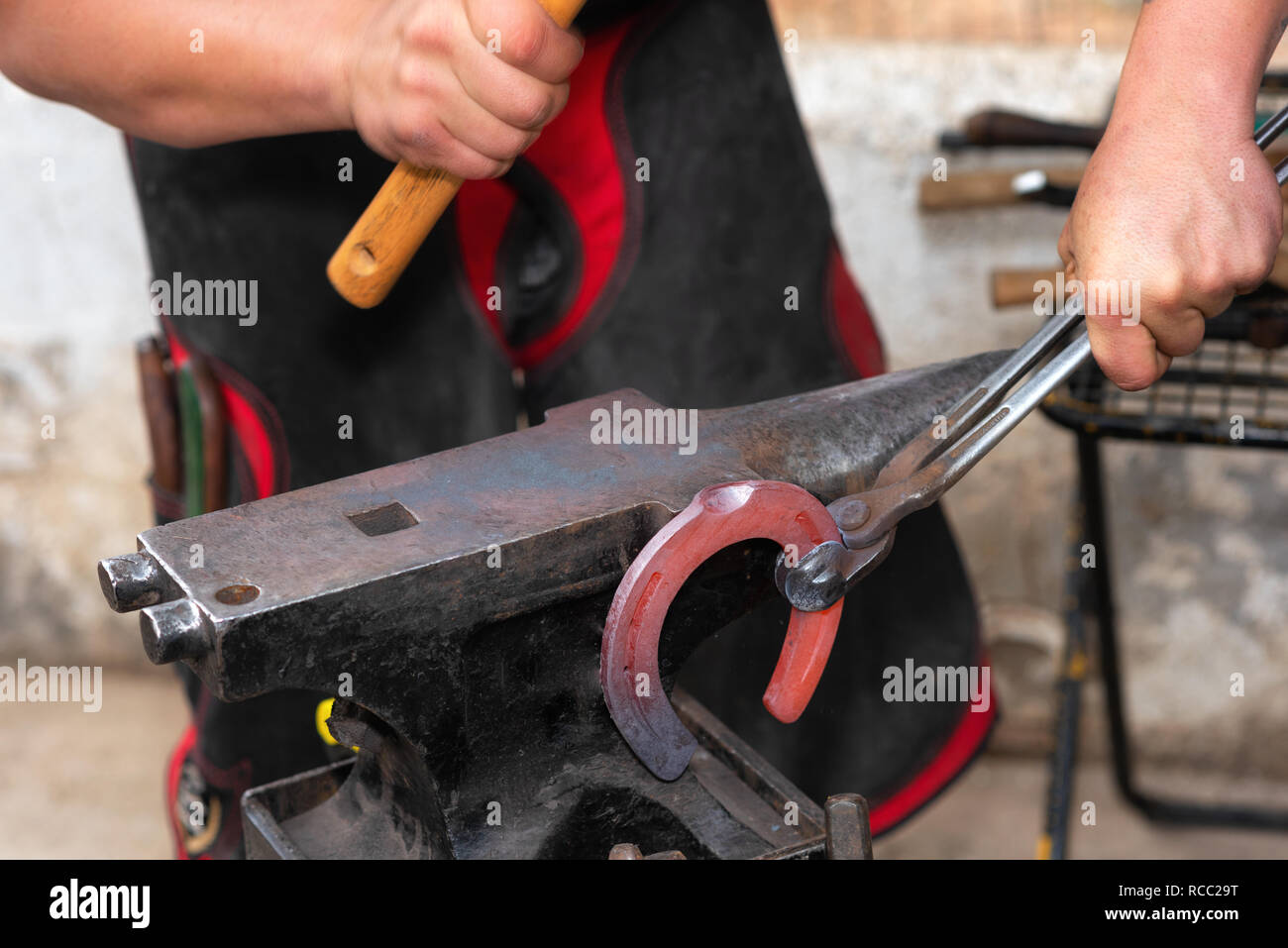 Blacksmith working on the anvil, making a horseshoe Stock Photo Alamy