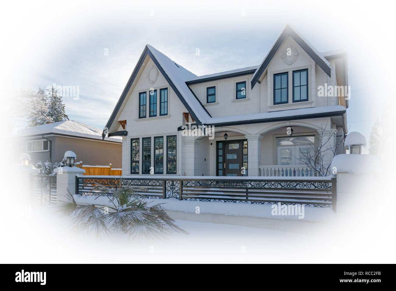 Luxurious residential house in snow on winter sunny day in Canada Stock Photo