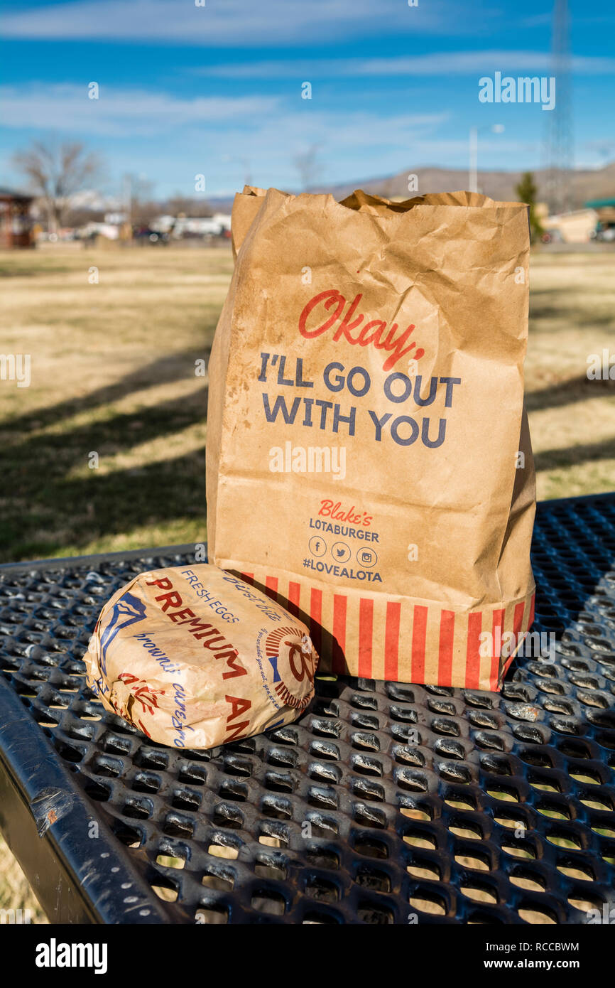 Take-out food order and hamburger, green chile cheeseburger in brown paper bag from Blake's Lotaburger in New Mexico, USA. Stock Photo