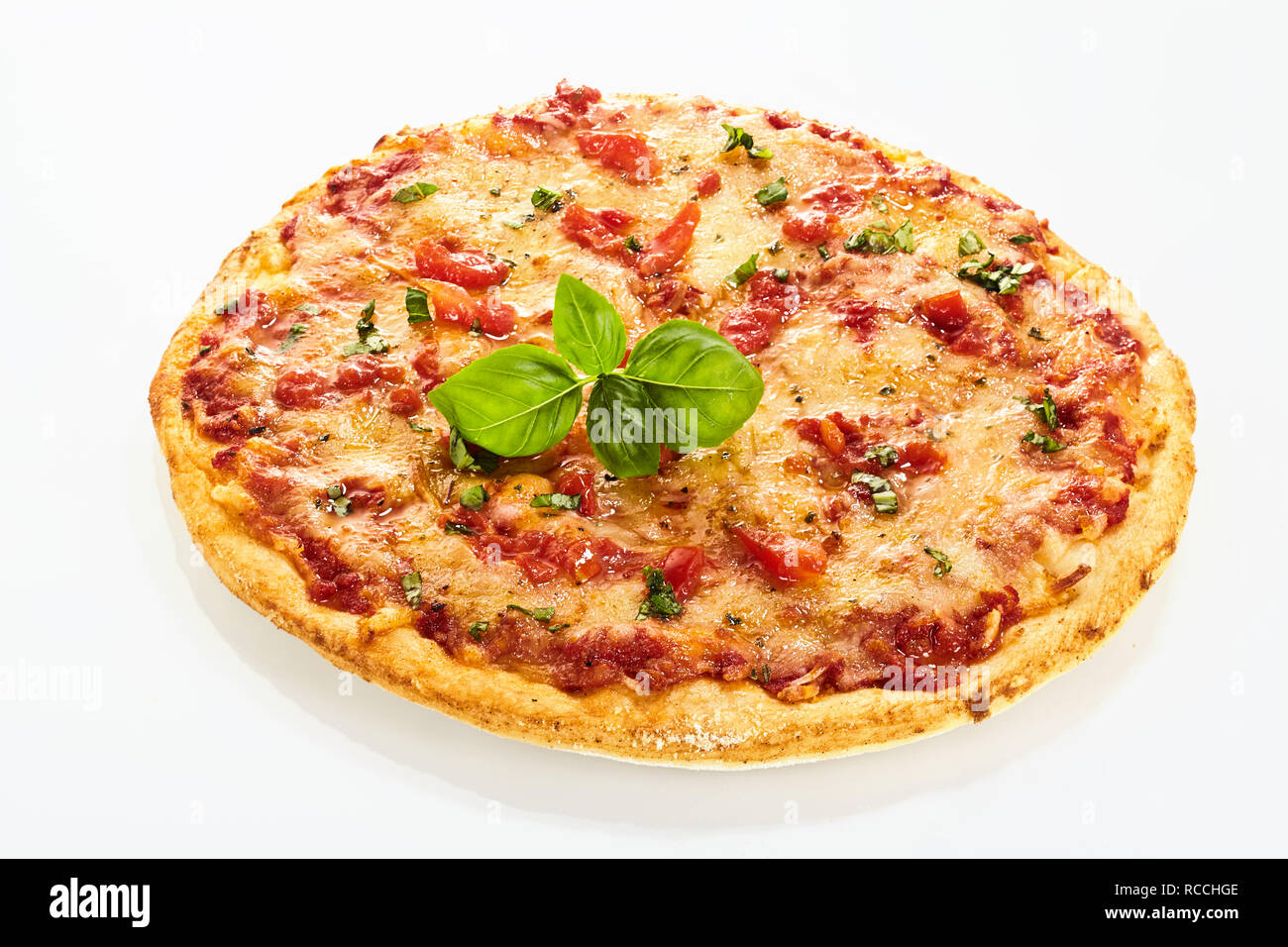 Neapolitan Margherita pizza decorated with fresh green basil leaf