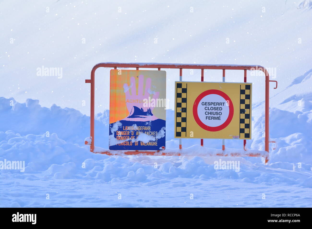 Avalanche danger sign. Closed road due to avalanche danger in the Austrian Alps. Massive snowfall in central Europe. Stock Photo