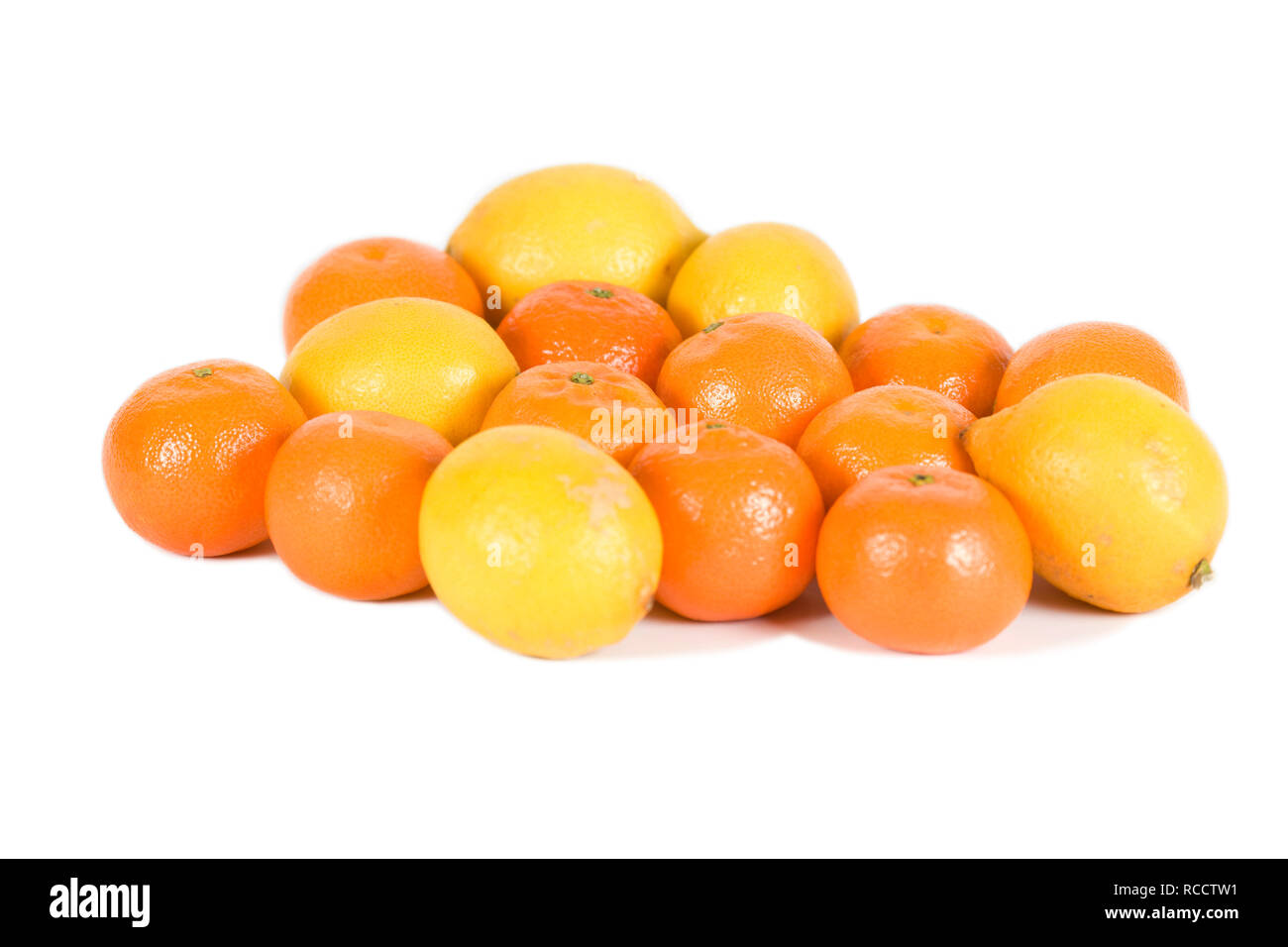 Satsumas and lemons on isolated white background Stock Photo