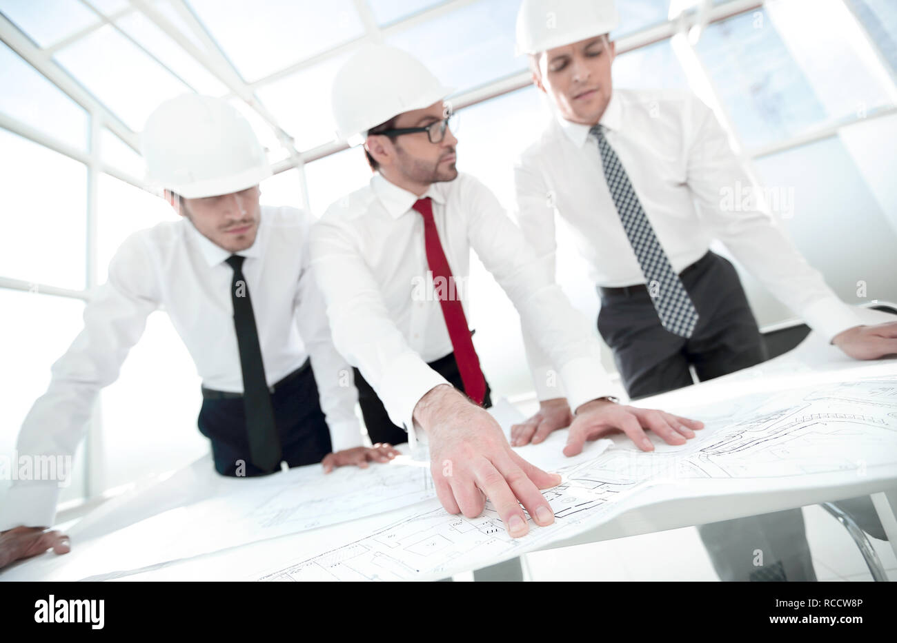 group of architects discussing sketches Stock Photo