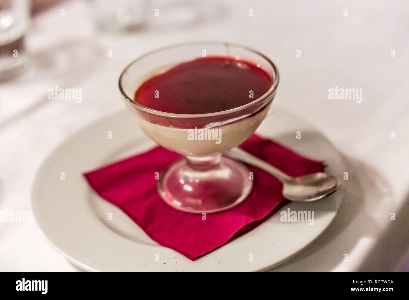 Typical Italian dessert in restaurant, Panna Cotta, meaning Cooked
