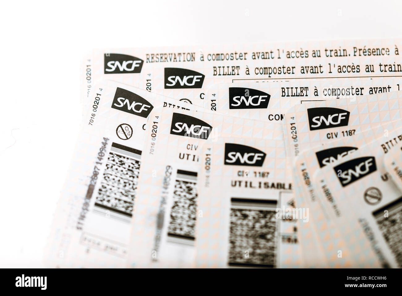 PARIS, FRANCE - JAN 14, 2015: View from above of SNCF Societe nationale des chemins de fer francais train tickets seen from above randomly arranged on a table Stock Photo