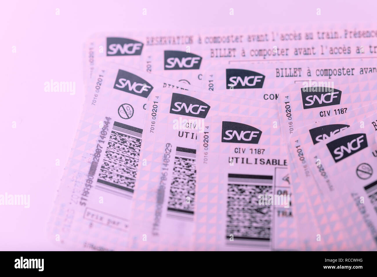PARIS, FRANCE - JAN 14, 2015: Stack of multiple SNCF Societe nationale des chemins de fer francais train tickets seen from above randomly arranged on a table Stock Photo